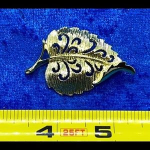 Leaf brooch with scrollwork vintage